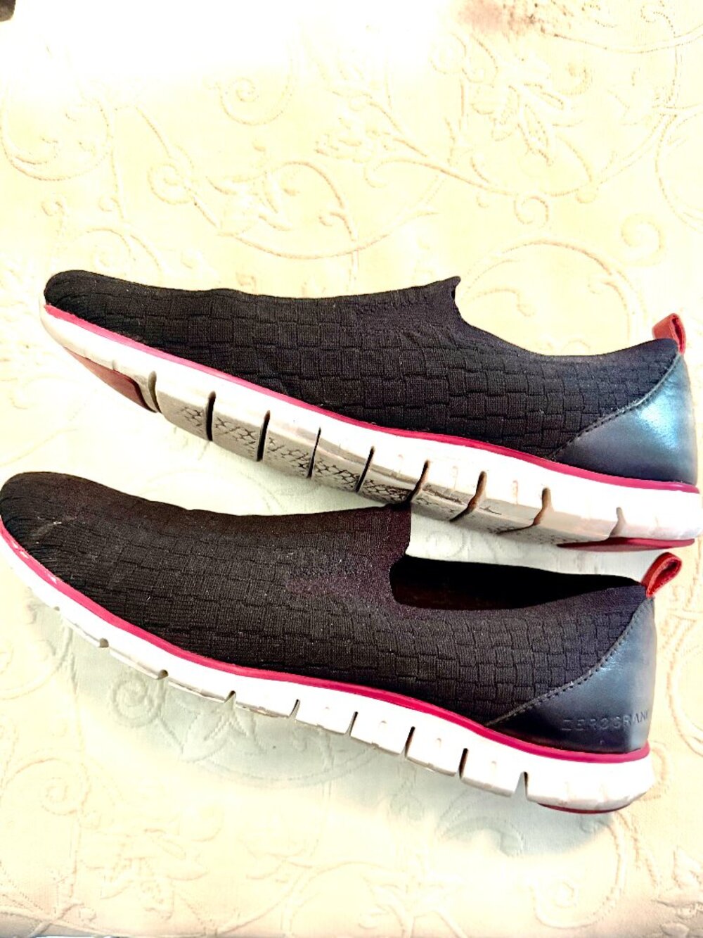 Zerogrand Stitchlite Slipon Sneakers in black with textured knit uppers